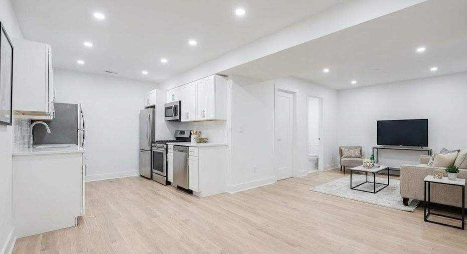 The same space transformed into a legal, modern ADU apartment. This unit now generates significant monthly rental income and has substantially increased the property's overall value.