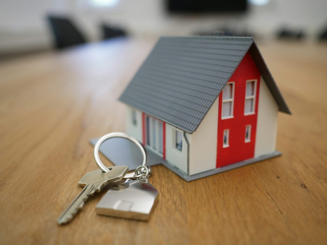 Professional real estate agent helping first-time home buyer with paperwork