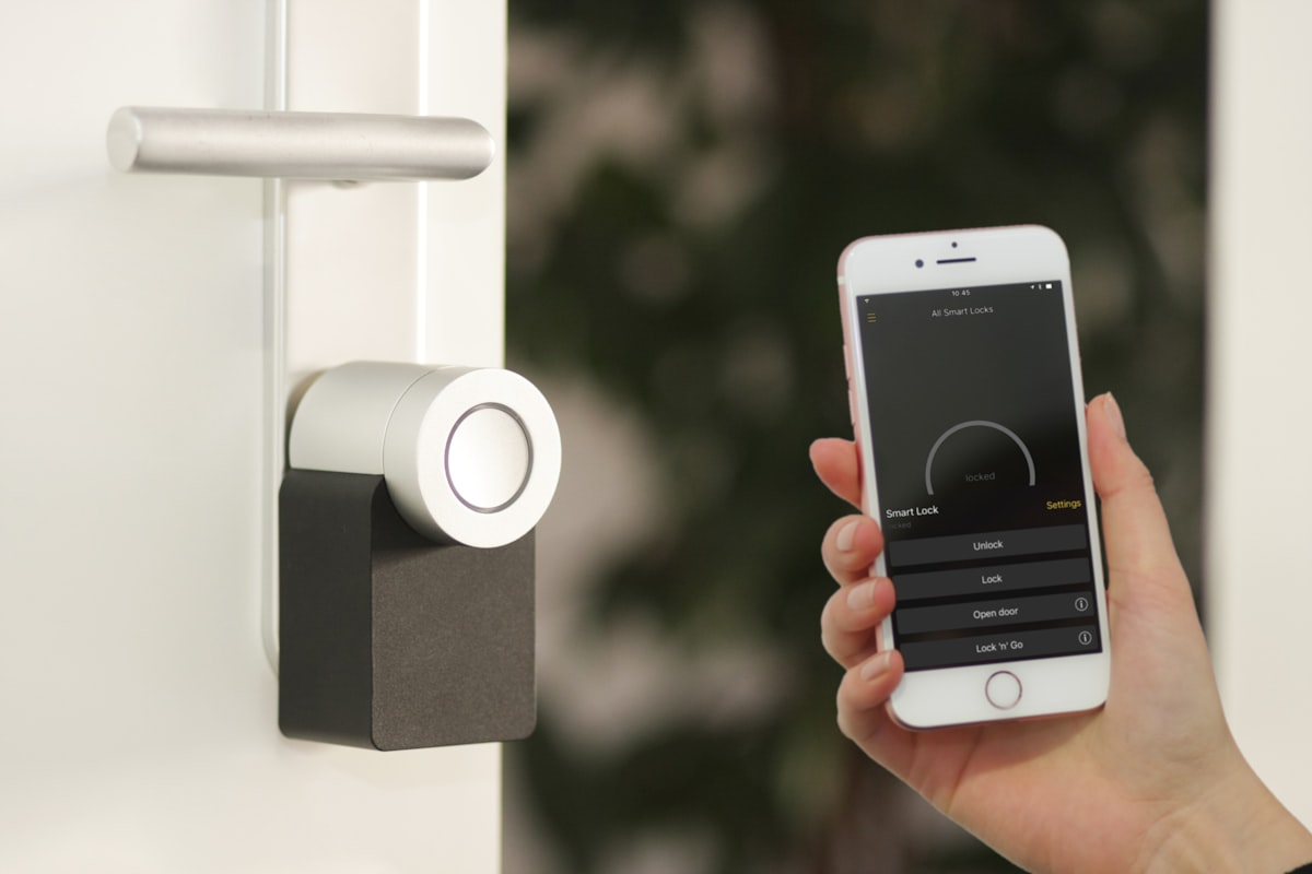 Modern smart home hub device on a wooden table with ambient lighting