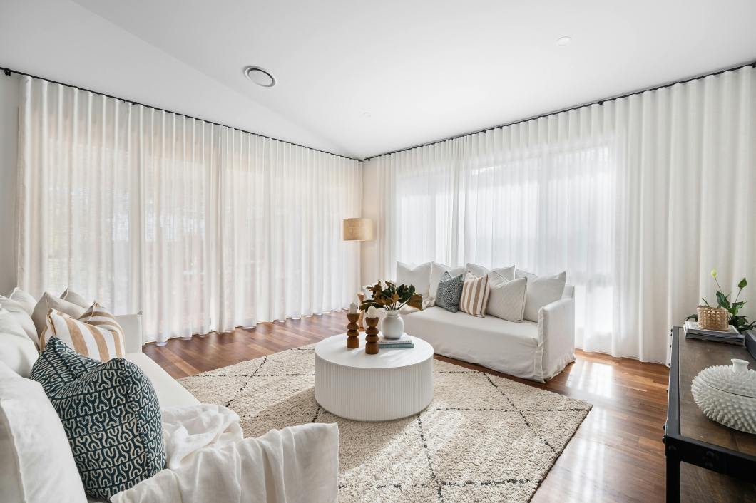 Clean minimalist living room showcasing successful home organization and decluttering results